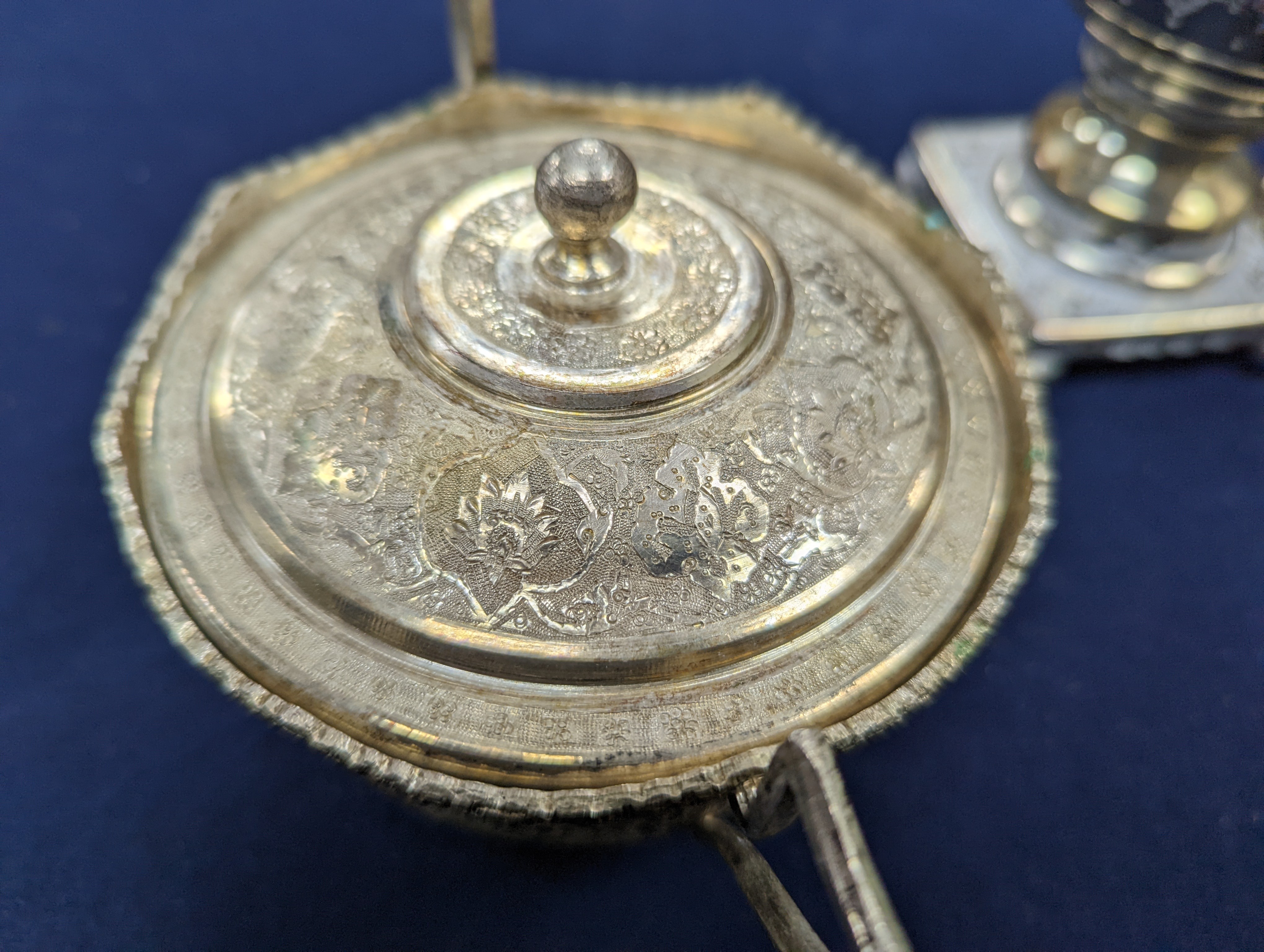 A set of six Persian embossed 84 standard white metal coffee cup holders and matching sugar bowl and cover by Vartan and four other Persian white metal items.